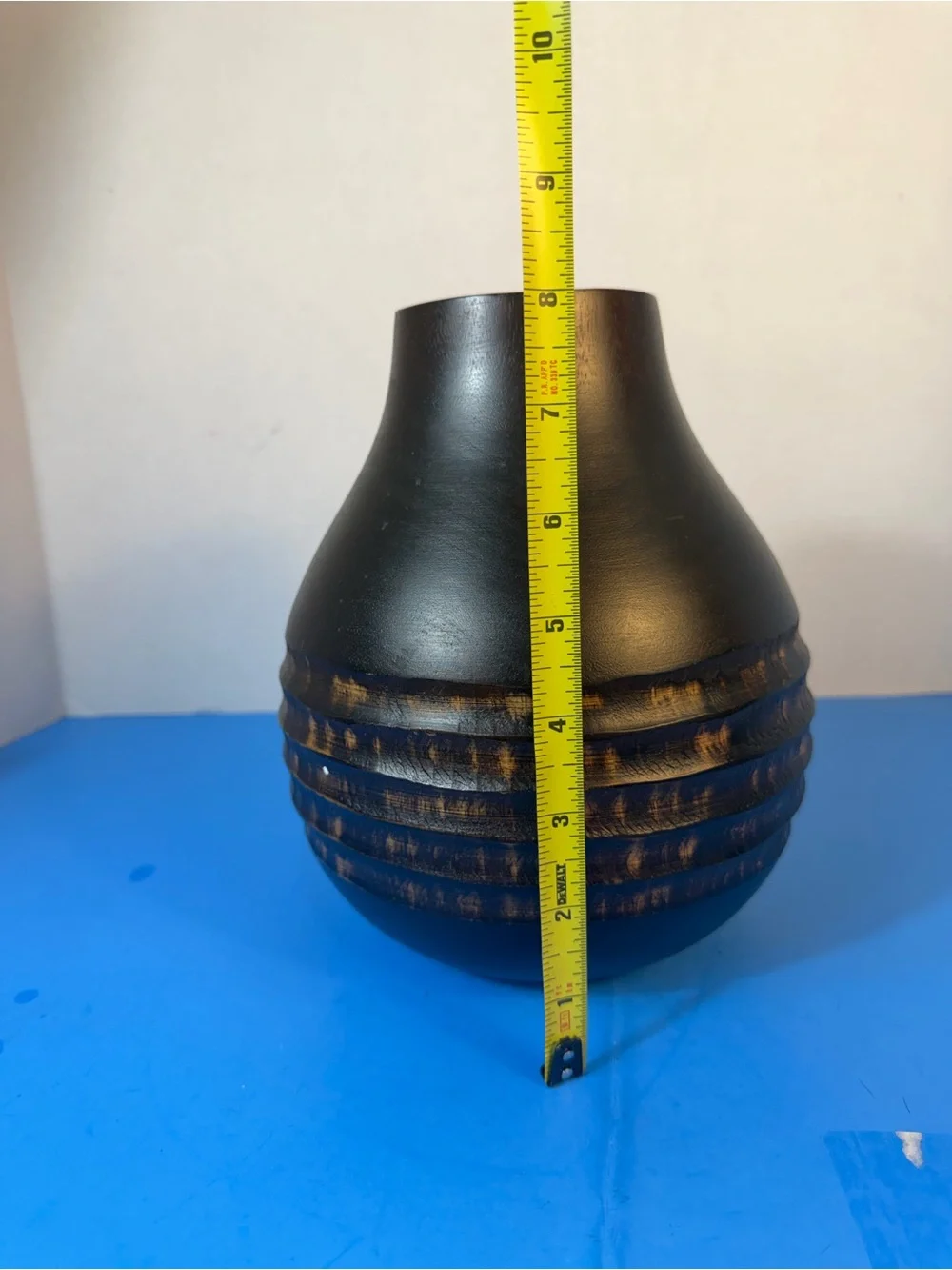 hand-carved wooden vase with contrasting texture